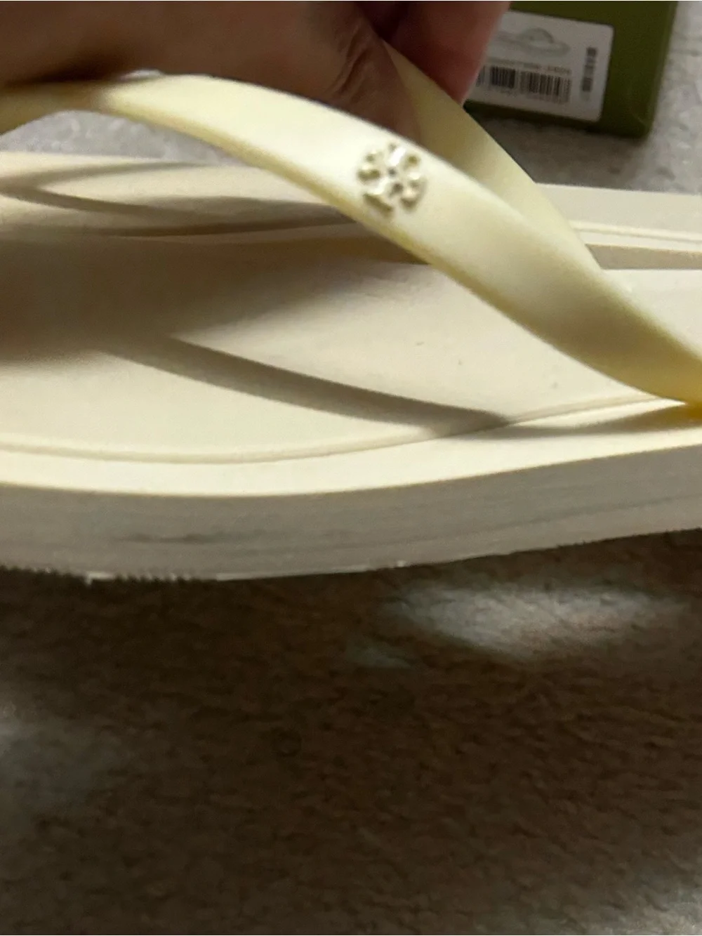 TORY BURCH KIRA padded flip flops in light yellow.